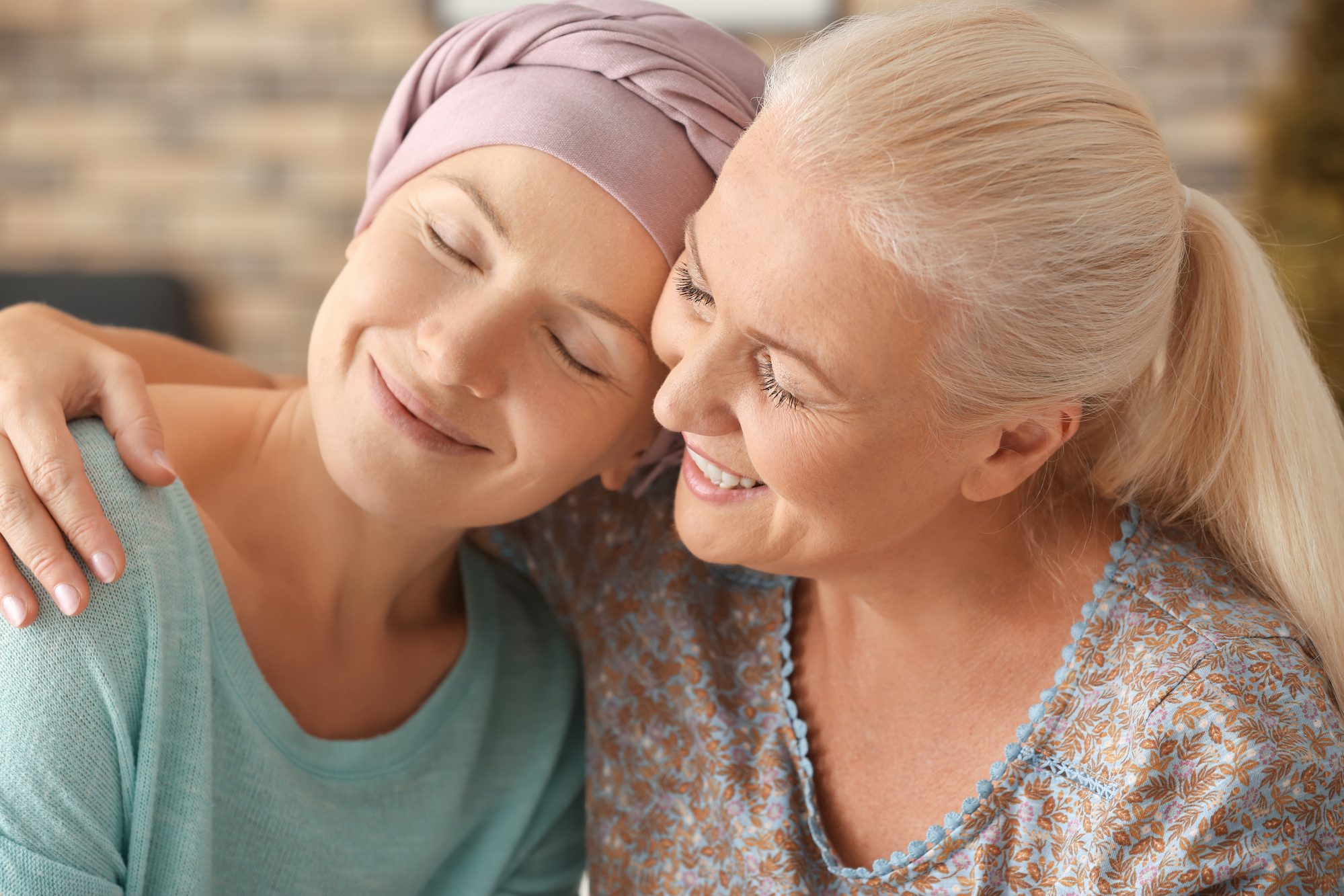 Mother with her daughter after chemotherapy at home